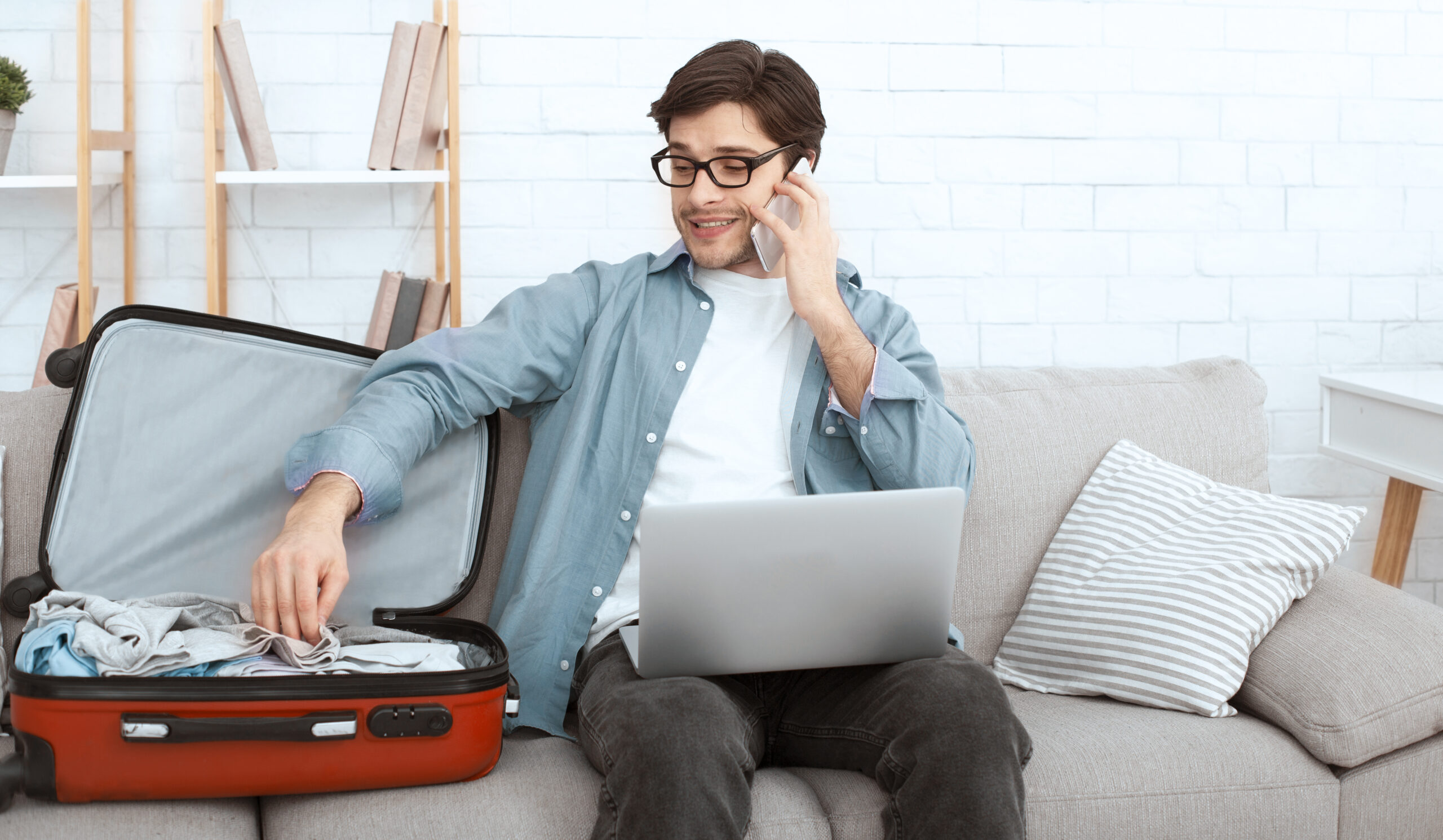 ready for trip man talking on phone and packing c 2025 03 18 17 24 24 utc scaled